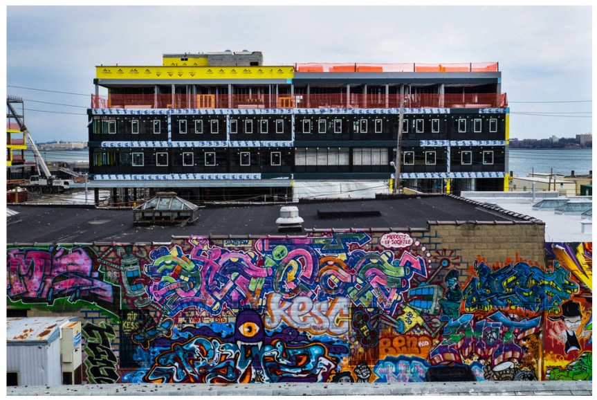 A view of URL Staten Island, a new residential and retail complex rising in the Stapleton neighborhood, from the Stapleton platform of the Staten Island Railway. URL overlooks Upper New York Bay. Credit Edwin J. Torres for The New York Times